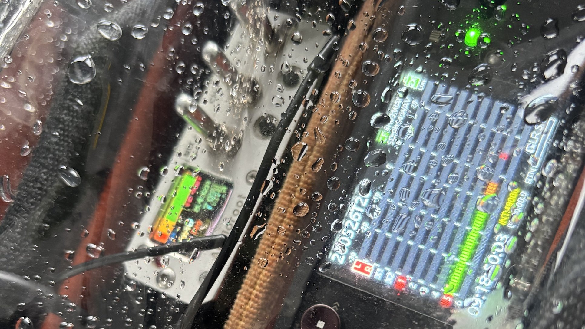 Location sound bag under a rain cover with recorder meters live, Hurtigruten coast
