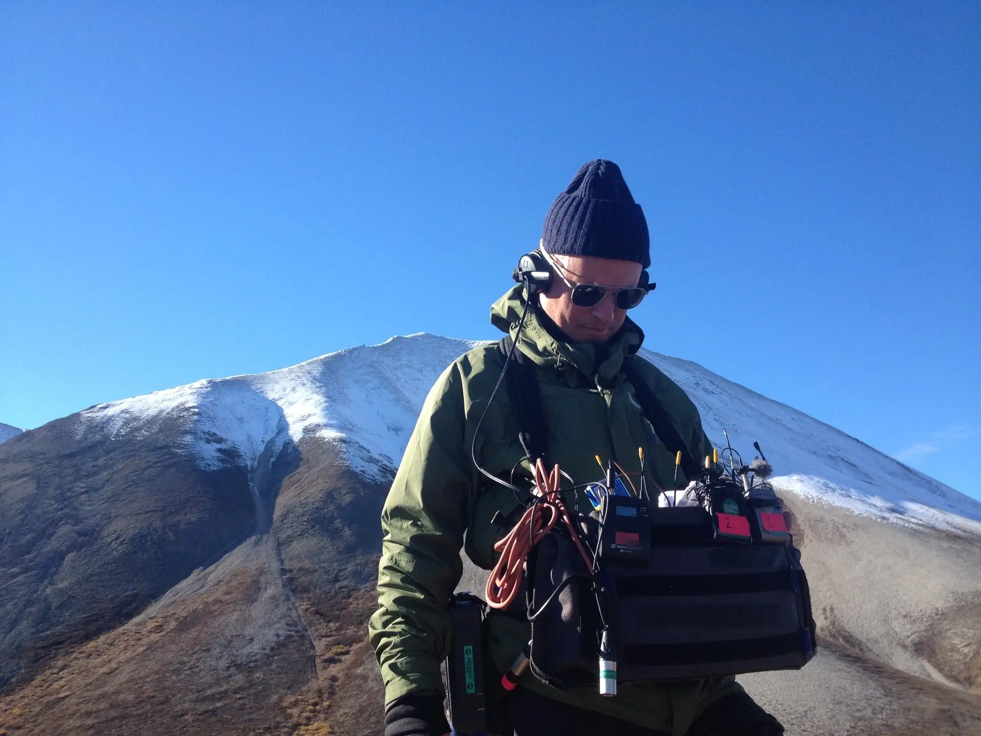 Location sound recordist on a film set in Sweden — boom, mixer and wireless lavaliers in action